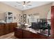 Home office with a wooden desk, modern equipment, and natural light at 2234 Callaway Ct, Davenport, FL 33837