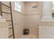 Tiled walk-in shower with ladder and seat provides a spa-like experience at 2234 Callaway Ct, Davenport, FL 33837