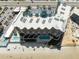 High angle aerial view of the complex showing beachfront, pools, and parking at 2403 S Atlantic Ave # 501, Daytona Beach Shores, FL 32118