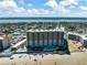 Aerial view of building featuring beach access, swimming pools, and waterfront views at 2403 S Atlantic Ave # 501, Daytona Beach Shores, FL 32118