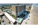 Stunning aerial view of a beachfront high-rise with pools and a beautiful sandy beach at 2403 S Atlantic Ave # 501, Daytona Beach Shores, FL 32118