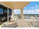Enjoy city views on this condo balcony with rocking chairs and tiled floors at 2403 S Atlantic Ave # 501, Daytona Beach Shores, FL 32118