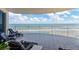 Enjoy breathtaking ocean views from this spacious tiled balcony with comfortable lounge chairs at 2403 S Atlantic Ave # 501, Daytona Beach Shores, FL 32118