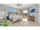 Cozy bedroom featuring a decorative headboard, balcony access, and a serene, relaxing ambiance at 2403 S Atlantic Ave # 501, Daytona Beach Shores, FL 32118