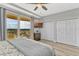 Bedroom with balcony access, providing ample natural light and scenic views and spacious closets at 2403 S Atlantic Ave # 501, Daytona Beach Shores, FL 32118
