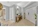 Inviting foyer with tile flooring, console table, and a view of the bathroom at 2403 S Atlantic Ave # 501, Daytona Beach Shores, FL 32118