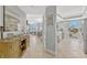 Hallway leading to an open-concept living area and kitchen with stainless steel appliances at 2403 S Atlantic Ave # 501, Daytona Beach Shores, FL 32118