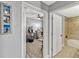 Hallway view leading to an office and bathroom, showcasing the home's modern layout and design at 2403 S Atlantic Ave # 501, Daytona Beach Shores, FL 32118