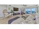 Spacious living room featuring a large sectional sofa, ocean views, and access to a private balcony at 2403 S Atlantic Ave # 501, Daytona Beach Shores, FL 32118