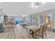 Open-concept living and dining area with hardwood floors and ocean views at 2403 S Atlantic Ave # 501, Daytona Beach Shores, FL 32118