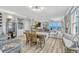 Open-concept living and dining area with ocean views, modern furnishings, and stylish decor at 2403 S Atlantic Ave # 501, Daytona Beach Shores, FL 32118