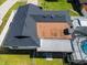 Aerial view of home featuring the backyard pool, sunroom, and a new roof at 2506 Bali Cir, Kissimmee, FL 34741