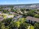 Residential neighborhood featuring lush trees and blue water in the backyard pool at 2506 Bali Cir, Kissimmee, FL 34741