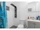 Updated bathroom featuring a modern shower with a rainfall showerhead, updated vanity, and stylish tiling at 2506 Bali Cir, Kissimmee, FL 34741