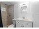 Bathroom showcasing tile shower and white sink at 2506 Bali Cir, Kissimmee, FL 34741