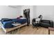 Bedroom with a bed, gaming chair, and closet, offering comfort and functionality at 2506 Bali Cir, Kissimmee, FL 34741