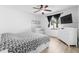 Comfortable bedroom with large window, ceiling fan and ensuite bathroom at 2506 Bali Cir, Kissimmee, FL 34741