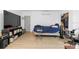 Bedroom featuring a bed, large TV, storage units and gaming chair, offering versatility at 2506 Bali Cir, Kissimmee, FL 34741