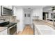 Charming kitchen features breakfast bar and leads to dining area and living room at 2506 Bali Cir, Kissimmee, FL 34741
