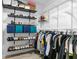 Organized walk-in closet with black and white shelving, shoe racks, and clothing rods for optimal storage at 2506 Bali Cir, Kissimmee, FL 34741