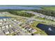 Picturesque aerial shot of a residential area featuring a scenic lake and well-maintained roadways at 2874 Turnstone Run, Harmony, FL 34773