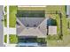 Overhead view of a home with a well-maintained roof and a backyard featuring a gazebo at 2874 Turnstone Run, Harmony, FL 34773