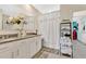 Elegant bathroom with double vanity, granite countertops, and a large mirror offering a spa-like atmosphere at 2874 Turnstone Run, Harmony, FL 34773