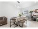 Cozy dining area with modern lighting, neutral decor, and tile floors, perfect for Gathering meals at 2877 Fitness St, Clermont, FL 34714