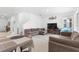 Bright and open living room with tile floors, comfortable seating, and a view of the staircase at 2877 Fitness St, Clermont, FL 34714