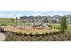 Community playground featuring modern equipment and a safe, cushioned surface, great for to enjoy at 2877 Fitness St, Clermont, FL 34714