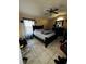 Bedroom features a ceiling fan, window, tile flooring, dresser, and bed at 3171 Santa Cruz Dr, Kissimmee, FL 34746