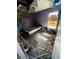 Bedroom with extensive fire damage, revealing the bed and window at 3171 Santa Cruz Dr, Kissimmee, FL 34746