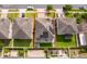 Aerial view of home, solar panels, backyard with artificial turf, paver patio and fenced yard at 3252 Toscana Dr, St Cloud, FL 34772