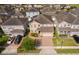 Aerial view of home and neighborhood showing roof, landscaping, solar panels and surrounding homes at 3252 Toscana Dr, St Cloud, FL 34772
