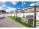 Outdoor living with pergola, paver patio, artificial turf and fenced yard at 3252 Toscana Dr, St Cloud, FL 34772