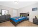 This bedroom features a gray bed, a matching dresser, and a matching night stand at 3252 Toscana Dr, St Cloud, FL 34772