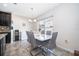 Bright dining area with a modern table, stylish chairs, and large window at 3252 Toscana Dr, St Cloud, FL 34772