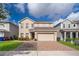 Charming two-story home with a well-maintained lawn and a two car garage at 3252 Toscana Dr, St Cloud, FL 34772