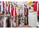 Organized walk-in closet with custom shelving and ample storage for clothes and accessories at 3252 Toscana Dr, St Cloud, FL 34772