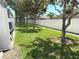 View of a well-maintained lawn and backyard featuring a privacy fence, offering a serene outdoor space at 3561 Sanctuary Dr, St Cloud, FL 34769