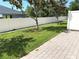 Exterior shot of the lush backyard with a well-maintained lawn and a tall, privacy fence for outdoor enjoyment at 3561 Sanctuary Dr, St Cloud, FL 34769