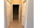 Hallway featuring a bathroom and closets at 3561 Sanctuary Dr, St Cloud, FL 34769