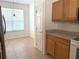 Functional kitchen space with efficient appliances, wood cabinetry, and a well-lit breakfast nook at 3561 Sanctuary Dr, St Cloud, FL 34769