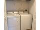 A well-lit laundry area with a matching washer and dryer set, perfect for convenient home chores at 3561 Sanctuary Dr, St Cloud, FL 34769