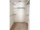 Spacious walk-in closet with wire shelving and neutral carpeting at 3561 Sanctuary Dr, St Cloud, FL 34769