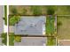 Aerial view showcasing the property with a well-maintained roof, landscaping, and surrounding neighborhood at 4007 Green Sabal Dr, Orlando, FL 32824