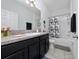 Bathroom with a vanity, a large mirror, a shower, and a tub at 4007 Green Sabal Dr, Orlando, FL 32824