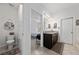 Bright bathroom featuring a vanity with granite countertop and decorative accents at 4007 Green Sabal Dr, Orlando, FL 32824