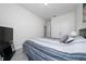 Neutral bedroom featuring light-colored walls, a comfortable bed, and a functional layout at 4007 Green Sabal Dr, Orlando, FL 32824