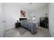 Cozy bedroom with a striped comforter, bedside tables, and a TV at 4007 Green Sabal Dr, Orlando, FL 32824